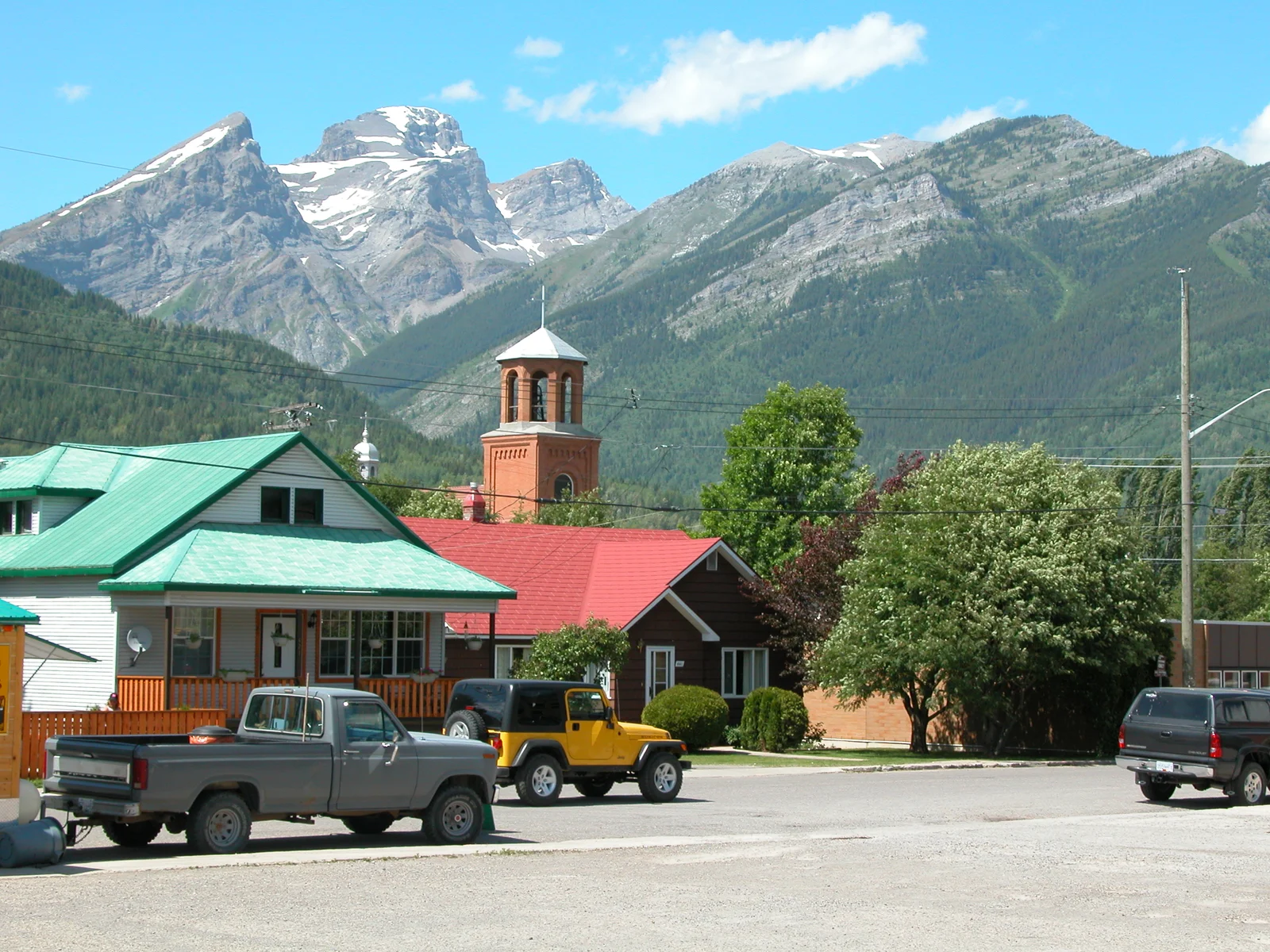 Archival June 2005 photograph of downtown Fernie with the Three Sisters and Mount Proctor in the background